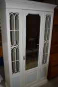 20th century shabby chic painted pine wardrobe having astral glazed doors with centre mirror