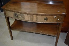 A Victorian Regency design sideboard or console table having curved frontage with tapered legs and