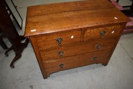 An early 20th Century oak bedroom chest of two over two drawers