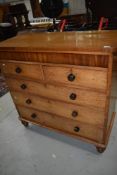 A 19th Century golden oak chest of two over three drawers having secret frieze drawer
