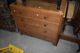 A vintage golden oak chest of two over three drawers, possibly Gomme