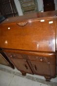 An early to mid 20th Century oak bureau