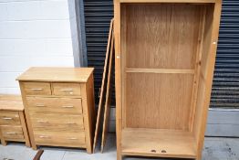 A modern golden oak double wardrobe and two over three drawer set