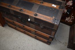 A vintage dome top travel trunk