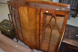 A mid 20th Century walnut display cabinet