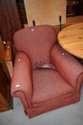 A modern easy chair in russet tones
