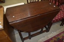 A nice quality period style reproduction oak gateleg dining table