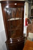 A reproduction Regency corner display cabinet