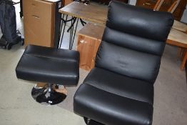 A black vinyl easy chair and footstool on chrome frame