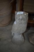 A concrete owl ornament