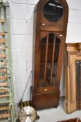 An early 20th Century oak cased long case clock in the Art Deco style