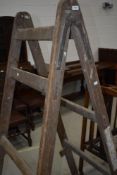 A vintage decorators wooden ladder/trestle platform