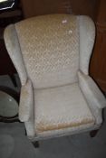 A reproduction easy armchair, nice quality heavy frame and wingbacks