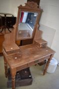 A Victorian dressing table having turned legs