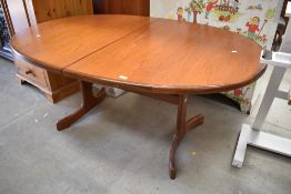 A vintage teak G plan or similar extending dining table