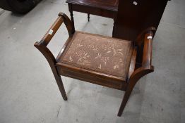An Edwardian mahogany piano stool