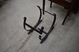A wrought iron log holder