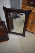 An early 20th Century mahogany wall mirror having applique decoration, approx. 80 x 54cm