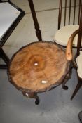 A mid 20th Century walnut circular coffee table on cabriole legs