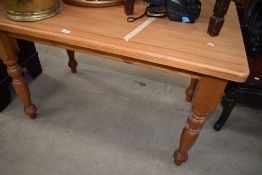 A modern natural pine kitchen dining table