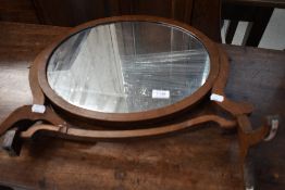 An early 20th Century mahogany toilet mirror (af)