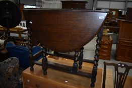 An early to mid 20th Century oak twist gateleg dining table