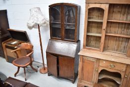 An Edwardian oak bureau and glazed book shelf with leaded light windows