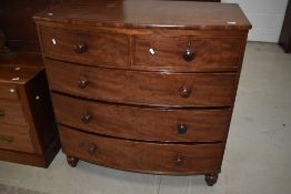 A Victorian mahogany bow front chest of two over three drawers