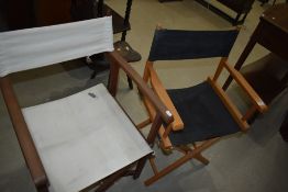 Two folding directors style chairs