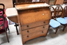 An Edwardian Bureau with three drawer set in oak