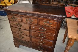 A 19th Century mahogany chest of drawers, interesting design three over four twos , drop handles and