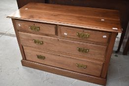 A late Victorian mahogany low bedroom chest of two over two drawers