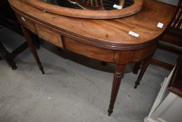 A 19th Century mahogany fold over tea table of Regency design