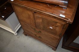 A Regency design side cabinet having brass drop handles and bracket feet