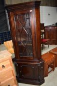 A reproduction mahogany corner display