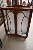 An early 20th Century walnut display cabinet
