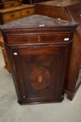 A 19th Century mahogany corner cupbpard having shell design inlay decoration