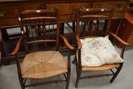 A pair of 19th Century spindle back armchairs having rush seats