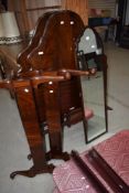 A pair of early 20th Century mahogany single bed frames and a similar full length mirror