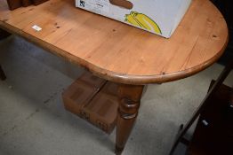 A modern pine oval dining table