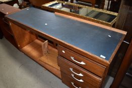 A traditional desk or shop counter with drawers to side open centre