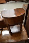 A vintage oak sewing table