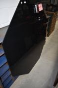 A vintage metal and glass designer dining table of octagonal form