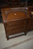 An early to mid 20th Century oak bureau