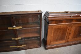 A Victorian substantial library book case and cupboard in mahogany with drawer and under cupboard