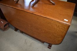 A vintage oak gateleg dining table