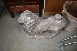 A concrete lion garden ornament