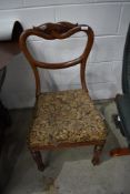 A Victorian mahogany balloon back chair having upholstered seat
