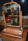 A 19th Century mahogany toilet mirror having drawer base