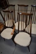A set of five (four plus one) 1960s wave and spindle back kitchen chairs, stamped 2056, 1966